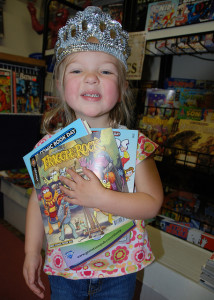 Girl Holding Comic Books