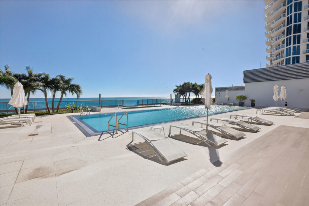 Ocean view from balcony at Monte Carlo Miami Beach — 6551 Collins Ave Heated outdoor pool at Monte Carlo short-term rental, Miami Beach Fully furnished bedroom with ocean views at Monte Carlo by Miami Vacations Direct beach access at Monte Carlo, 65th and Collins Avenue, Miami Beach Full kitchen in 1-bedroom oceanfront apartment at Monte Carlo Miami Beach